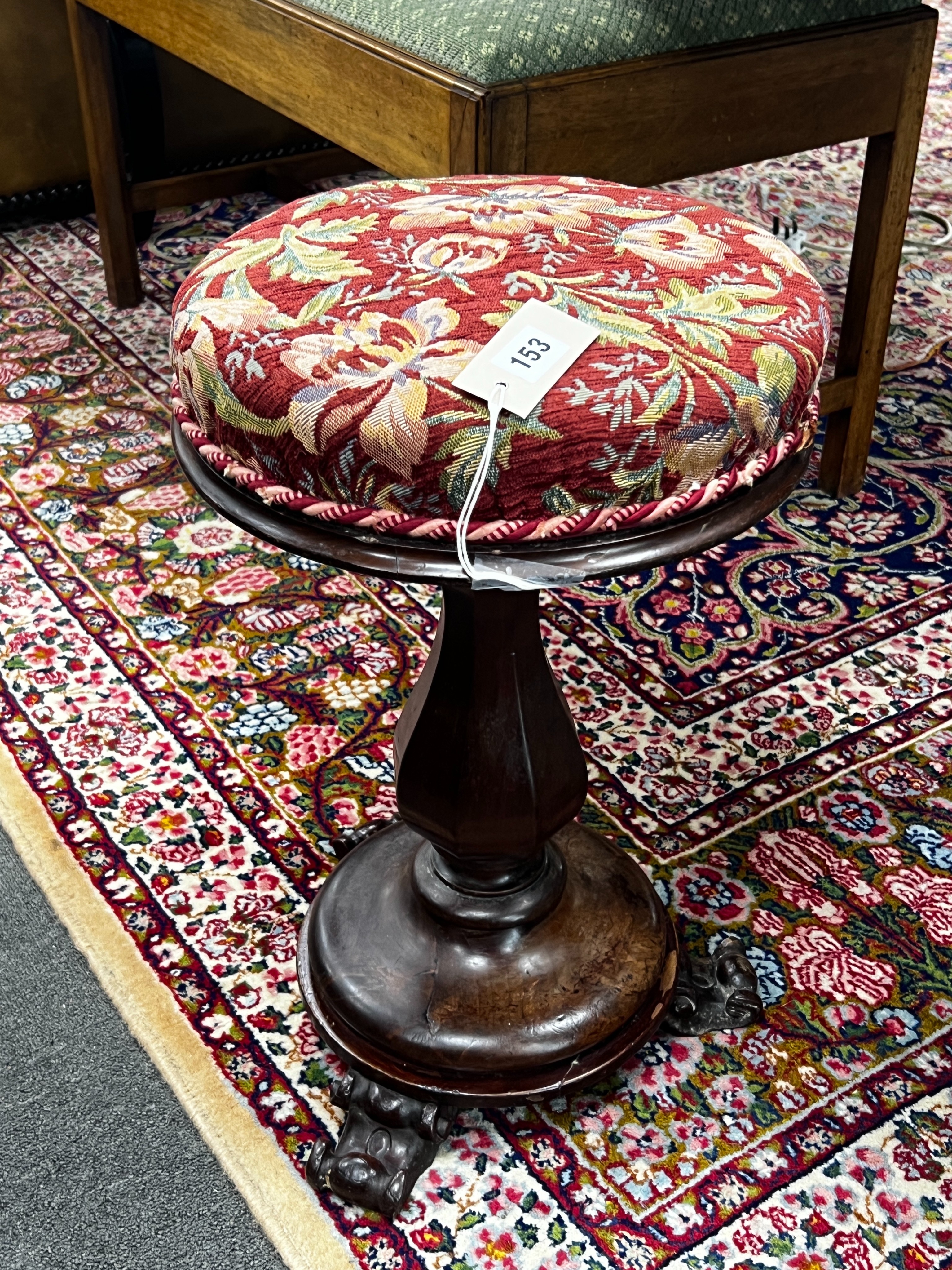 An early Victorian mahogany revolving piano stool